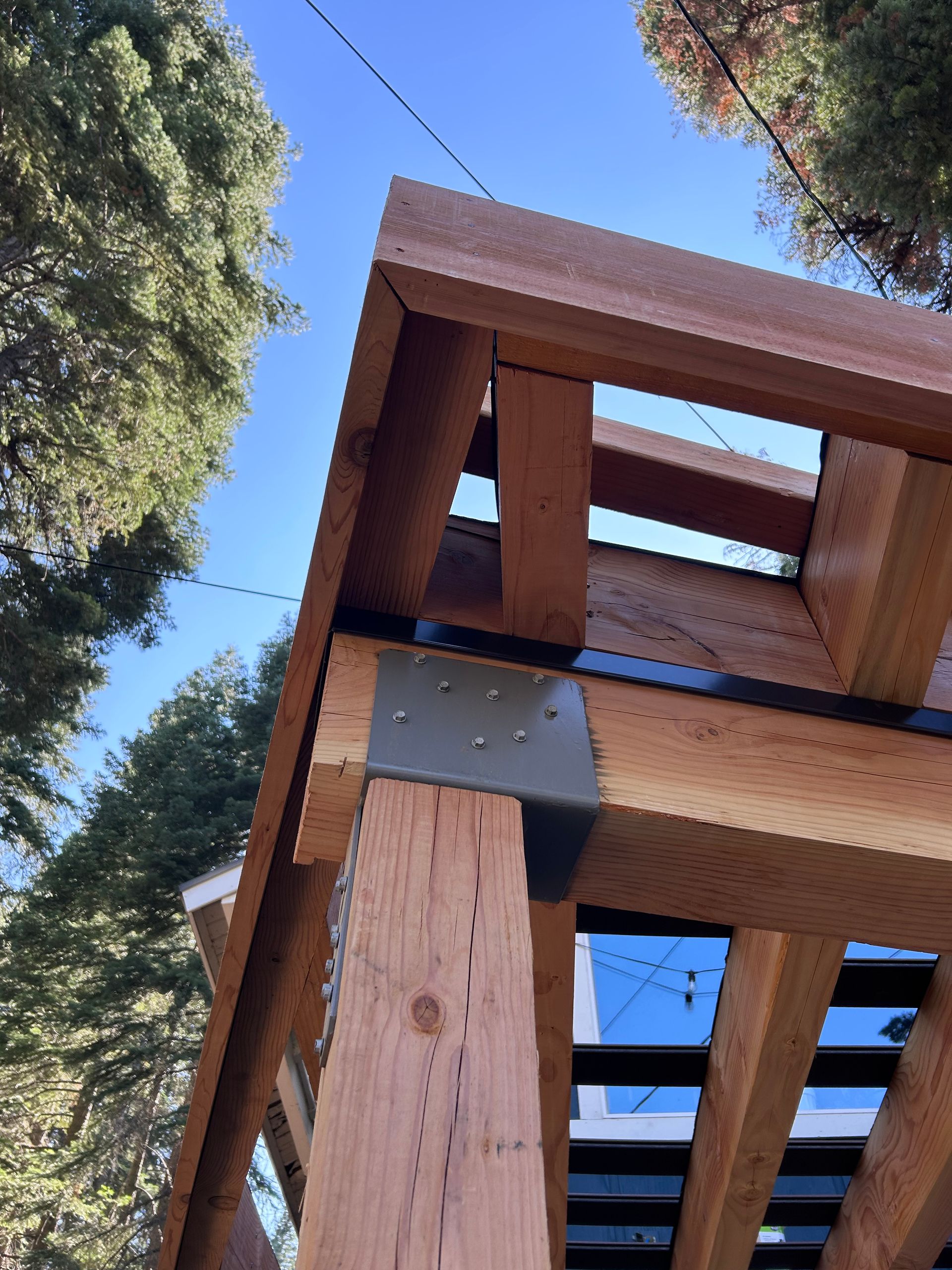 A wooden structure with a blue sky in the background