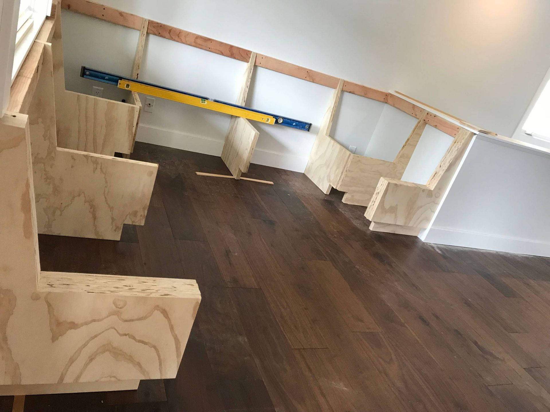 A house is being built in the middle of a dirt field