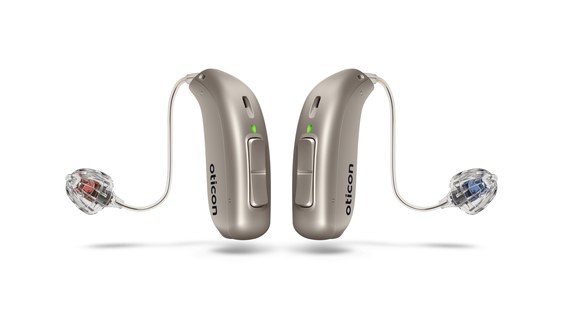 Two beige Oticon hearing aids on a white background.