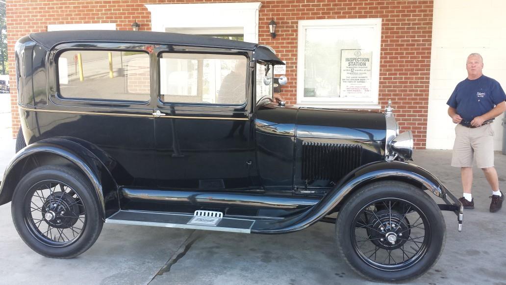 Man Beside Black Vintage Car — Colonial Heights, VA — Colonial Tire & Auto