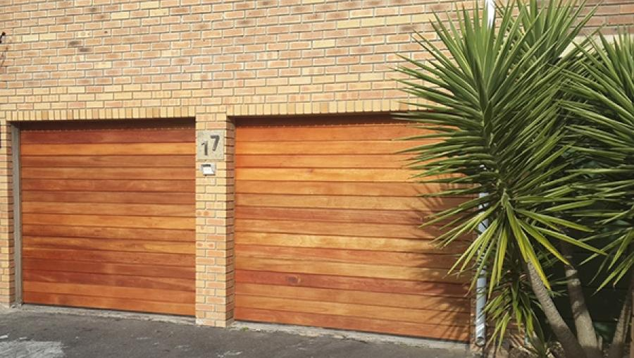 two single wooden garage doors