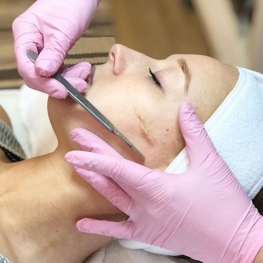 dermaplaning treatment on female