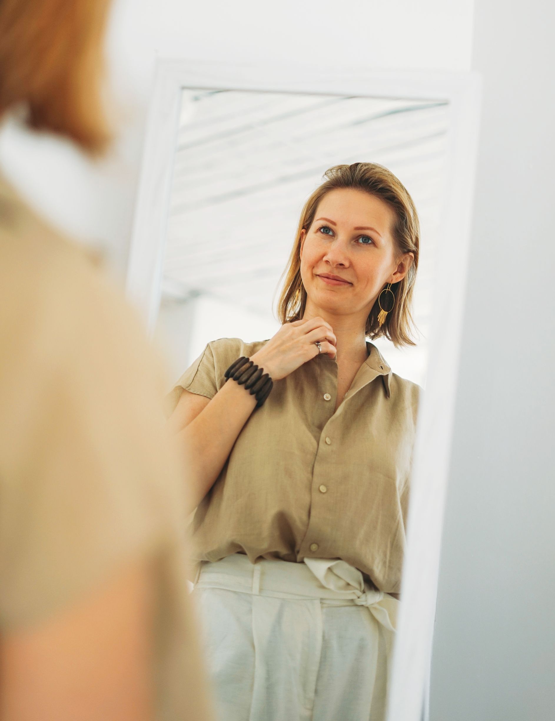 attractive woman smiling in mirror