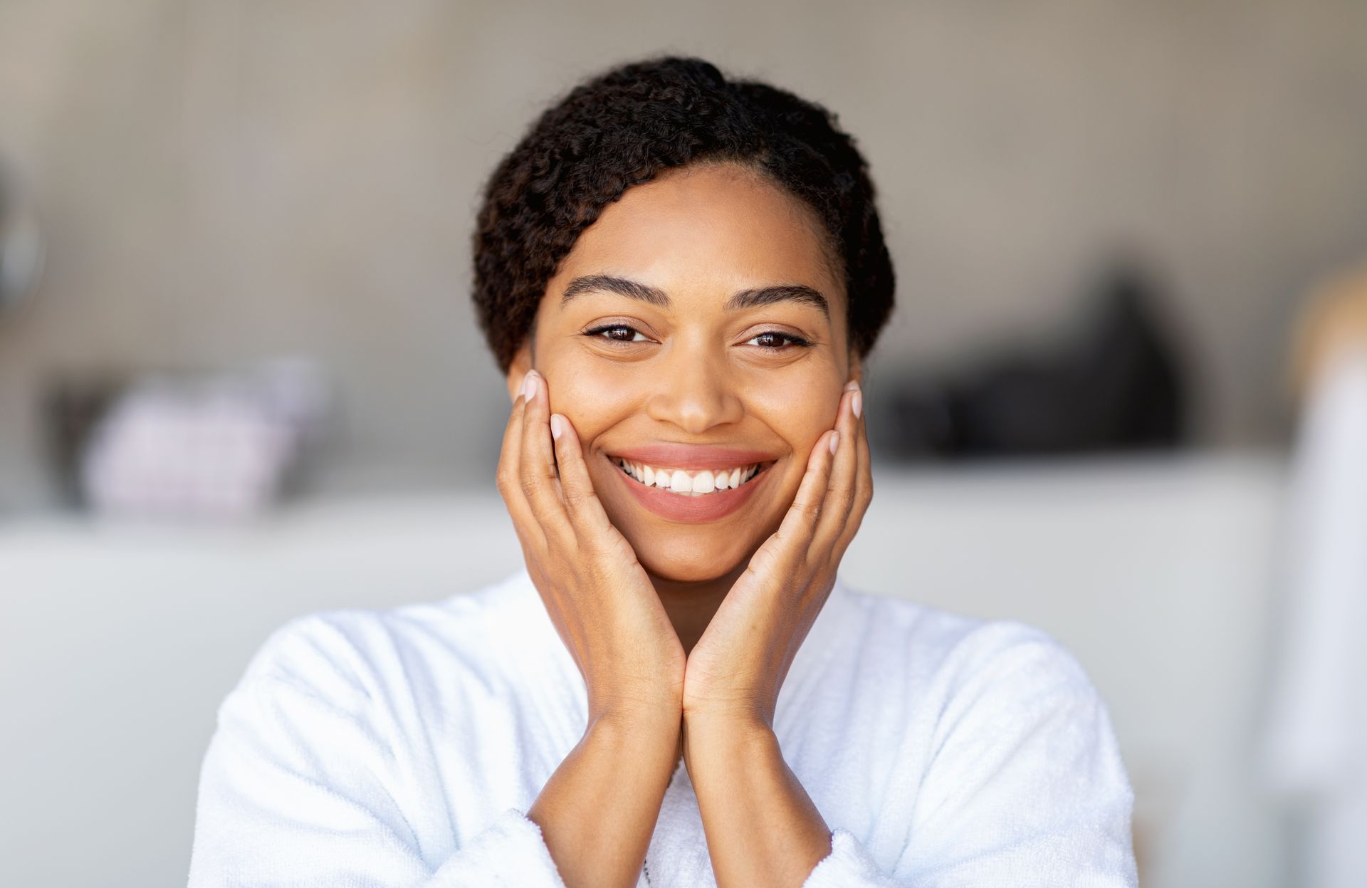 A woman is getting a facial treatment at a beauty salon.