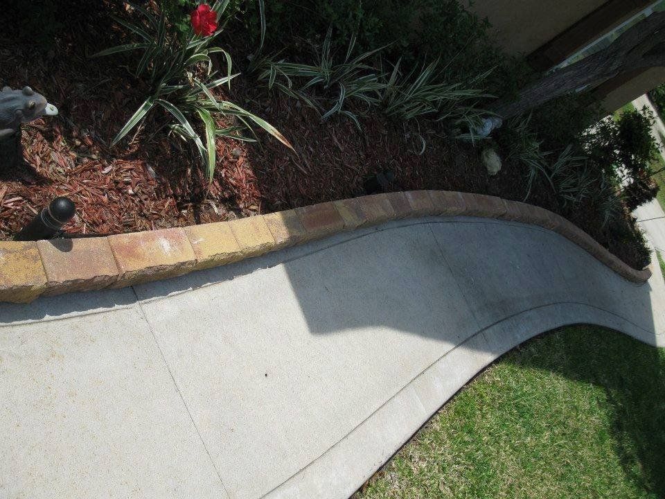 Flower Bed Hem — Mulch in Garden with Concrete in Brunswick, GA
