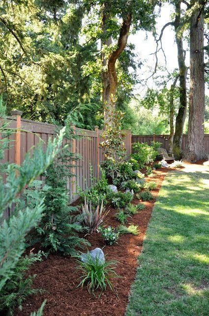 Flower Bed Brim — Mulch and Plant with Green Grass in Brunswick, GA
