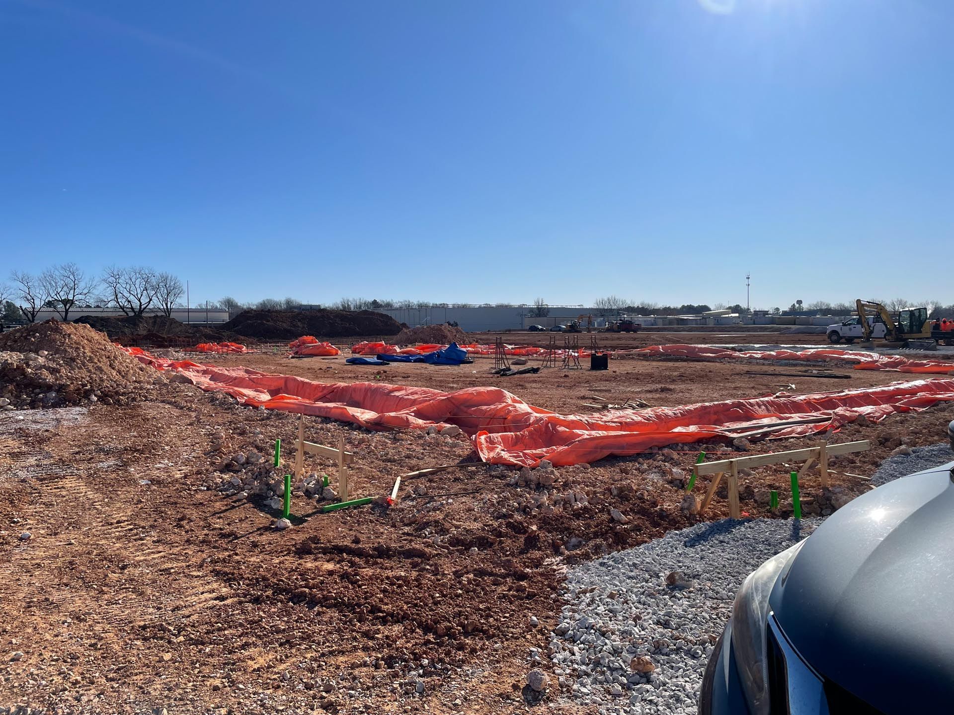 A truck is parked in front of a construction site.
