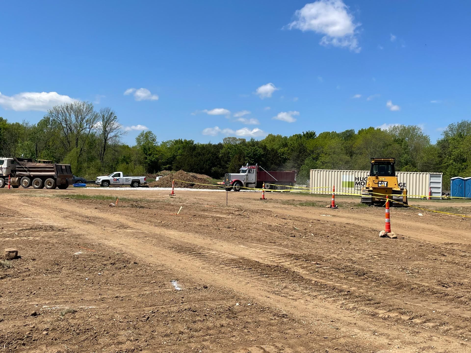 A construction site with a bulldozer in the middle of it.