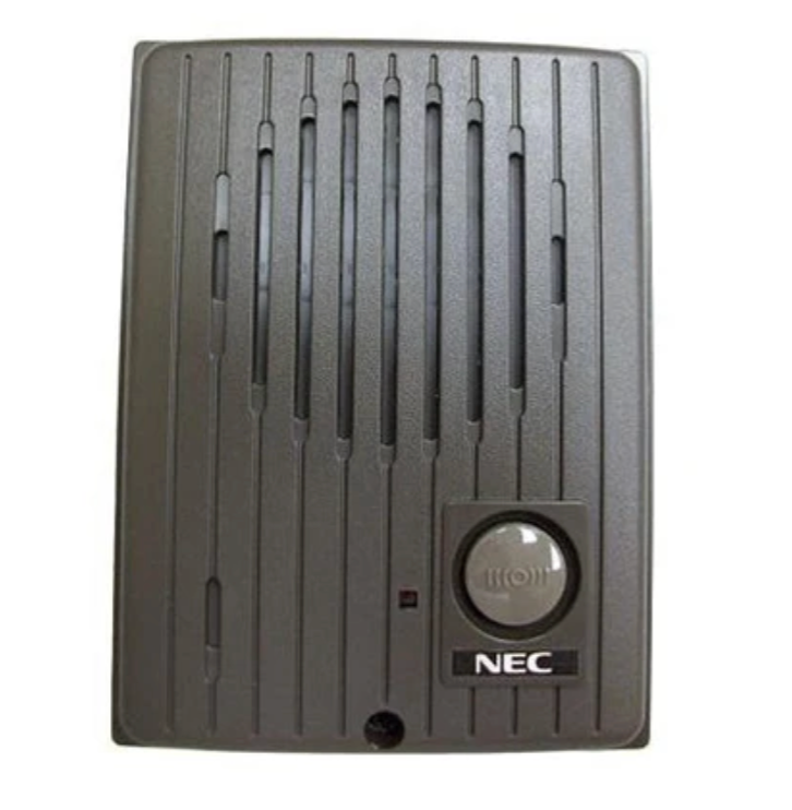 A nec doorbell is sitting on a white surface.