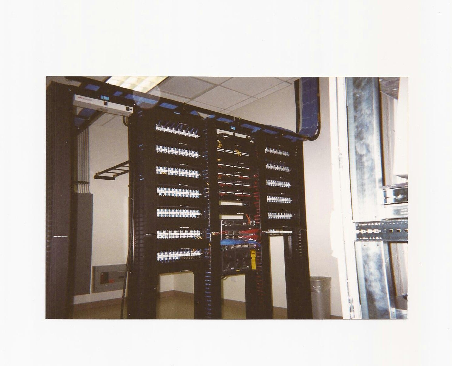 A picture of a server room with a bunch of servers