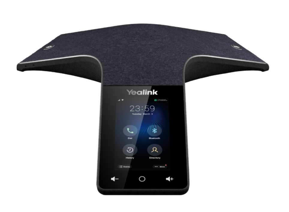 A yealink phone is sitting on top of a table.