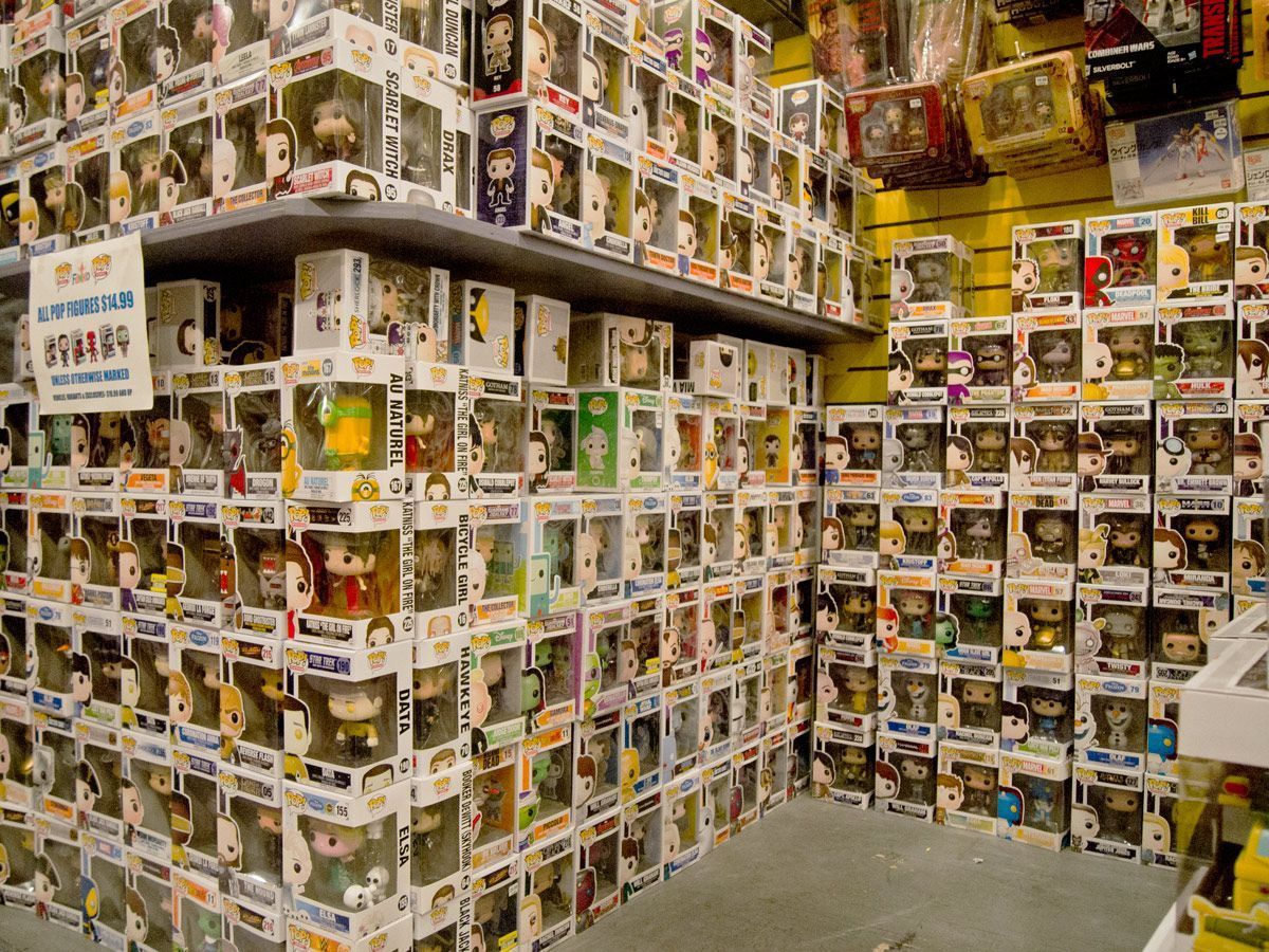 Shelves and walls stacked with various Funko Pop figures in their boxes.