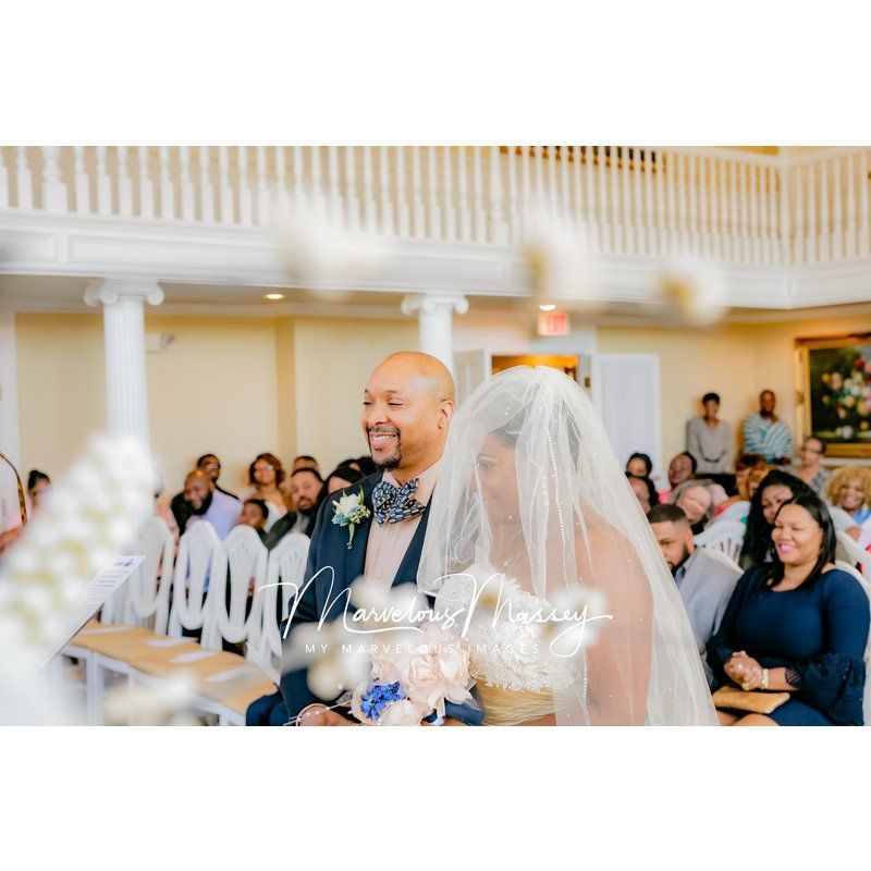 A bride and groom are walking down the aisle at their wedding ceremony.