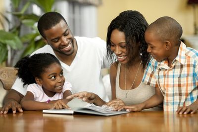 family reading a book