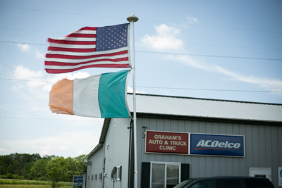 Flags raised outside shop | Grahams Auto & Truck Clinic 