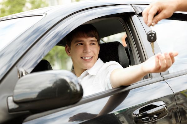 Young Man being given car keys, ready to drive | Grahams Auto & Truck Clinic