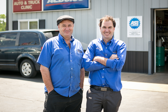 Two staff members outside our shop ready for work | Grahams Auto & Truck Clinic
