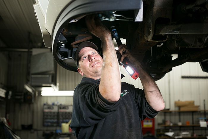 Working under a car | Grahams Auto & Truck Clinic
