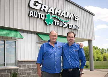 Two staff members outside of shop | Grahams Auto & Truck Clinic