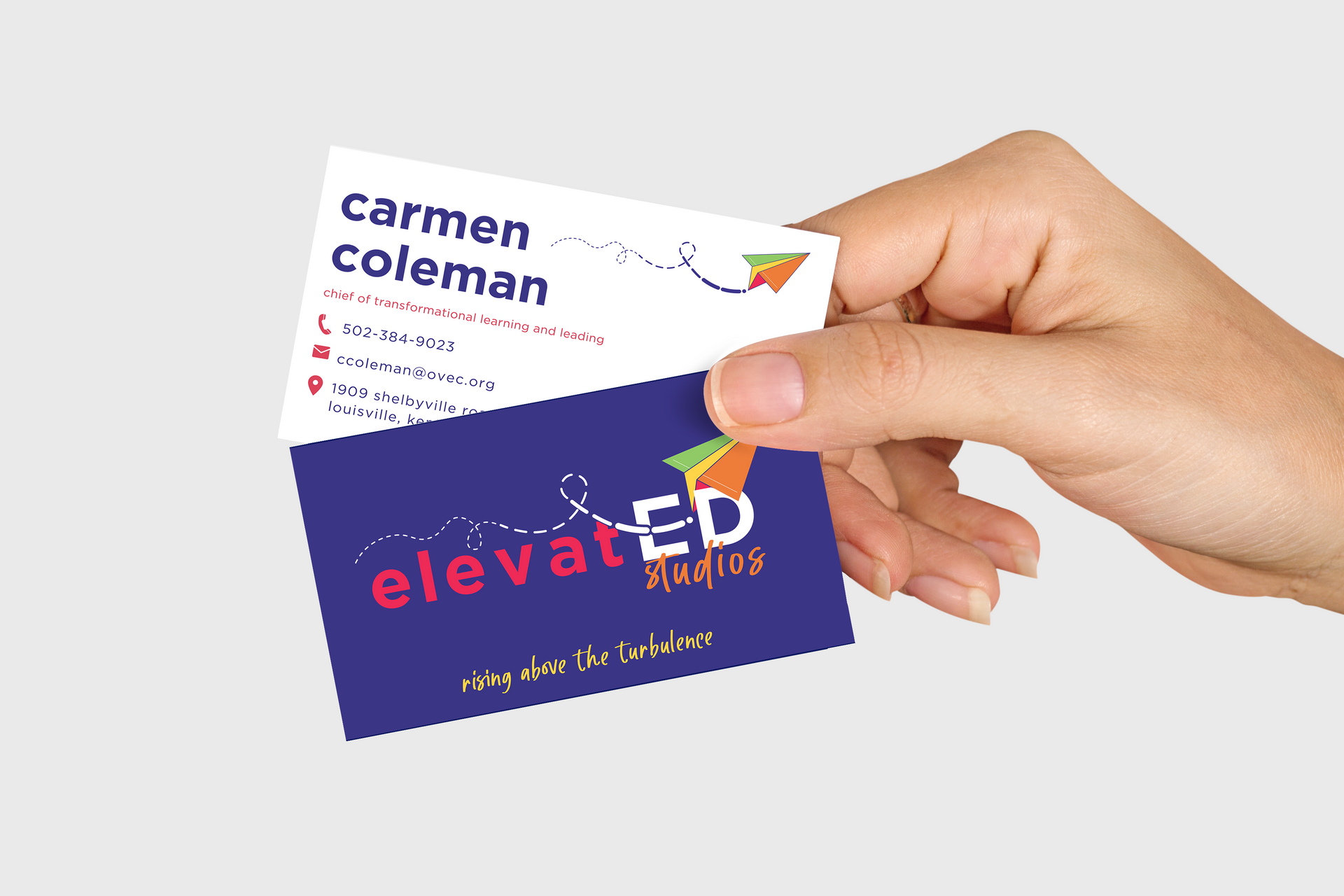 A person is holding a business card for carmen coleman