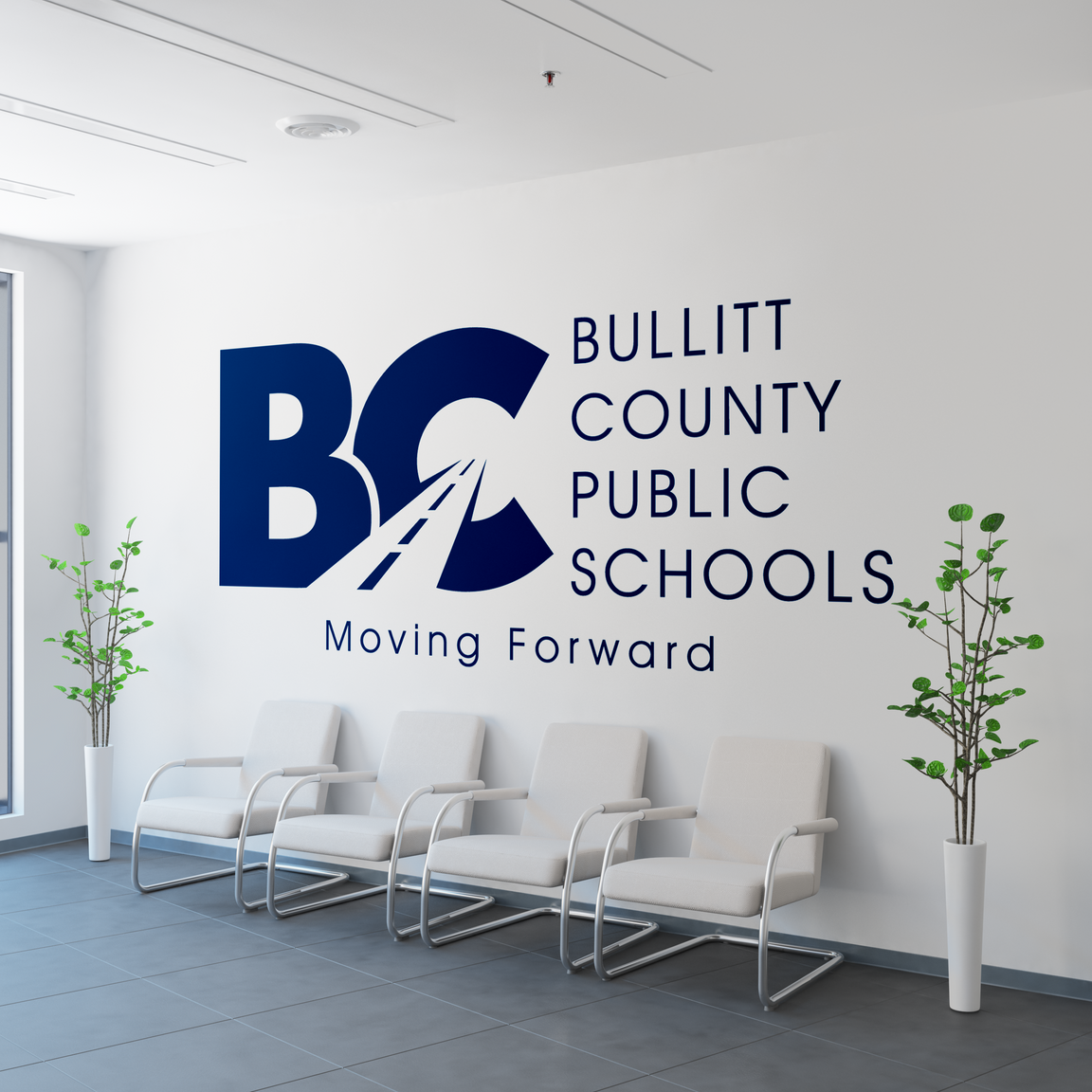 A waiting room with a bullitt county public schools logo on the wall