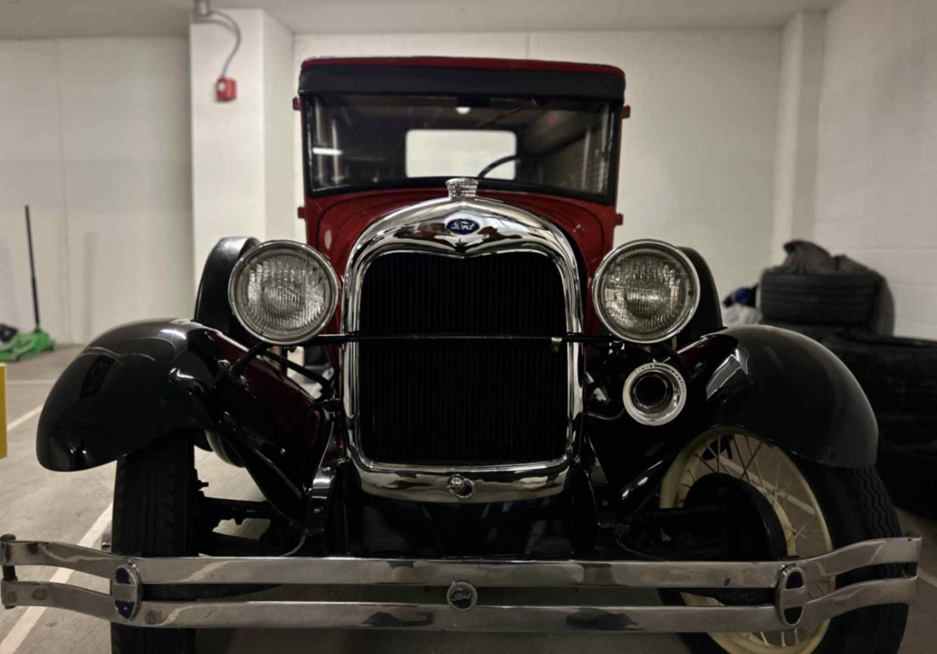 Vintage Ford Model A indoors with restored shine, clean bodywork, and bright trim after gentle detailing suited for classics.