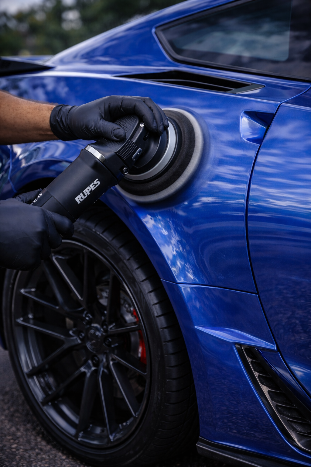 Berger Mobile Detailing technician using a dual-action polisher on Ford Mustang
