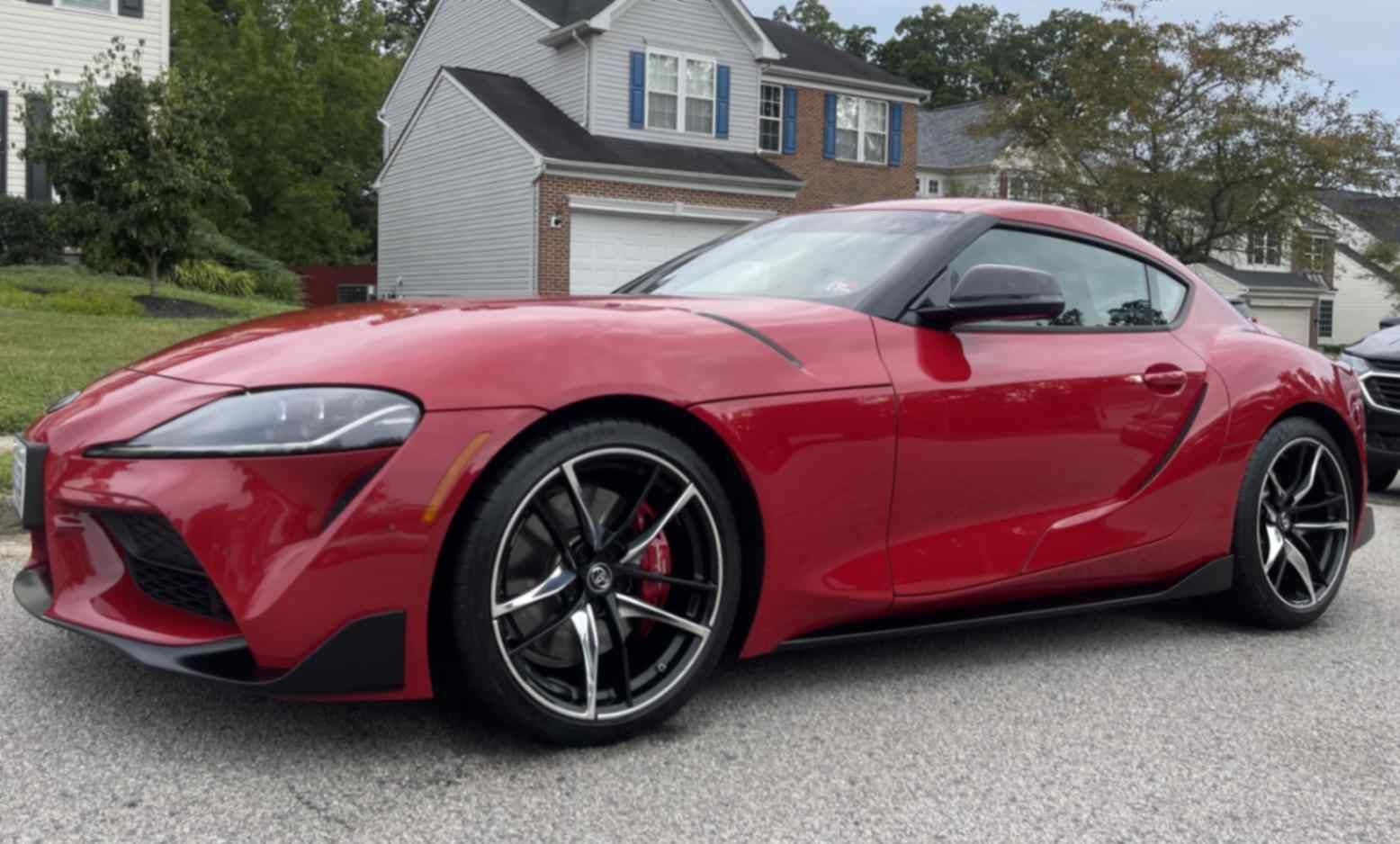 Toyota GR Supra with sharp curves, glossy paint, and clean wheels after a decontamination wash.