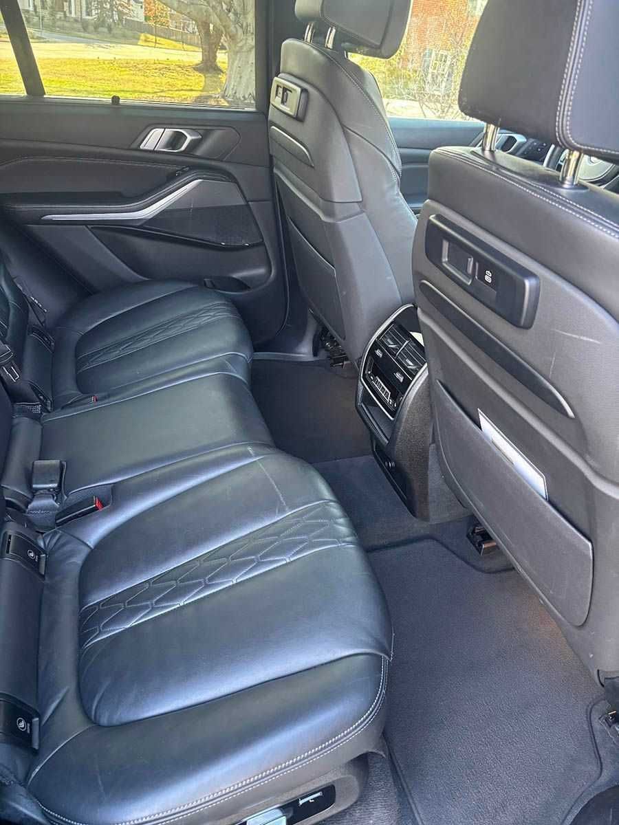 Cleaned leather seating following targeted vomit removal and odor neutralization.