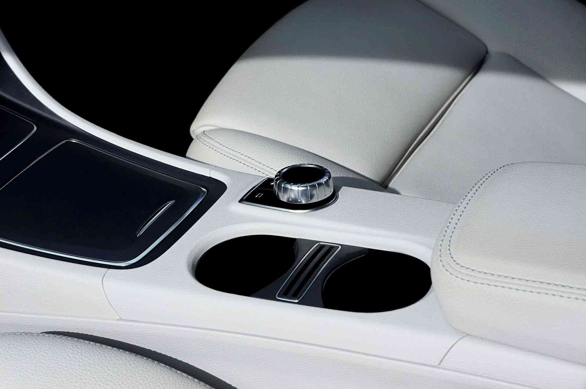 Detailed shot of clean leather console and cup holder post-ceramic application