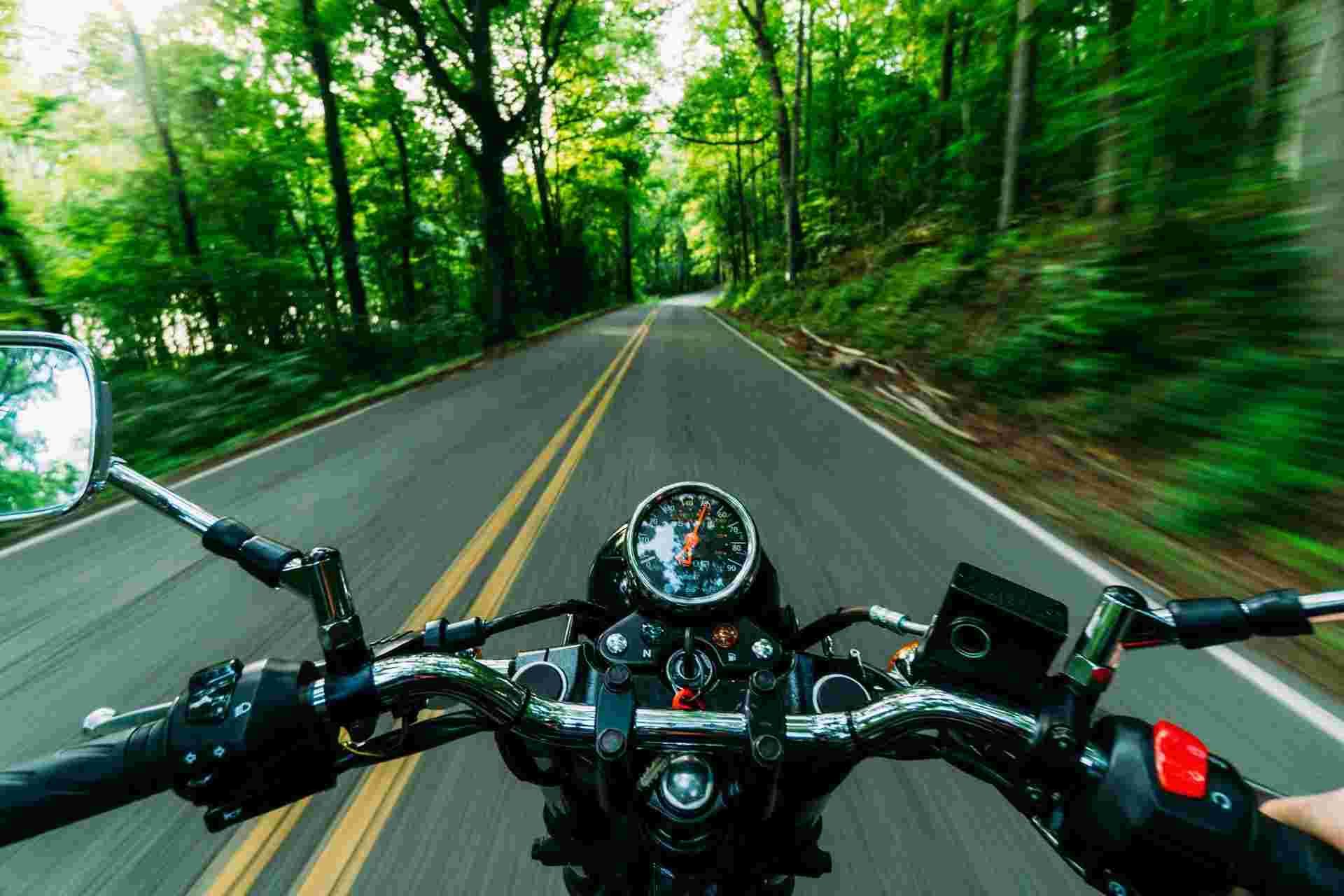 Scenic view from motorcycle rider’s perspective on freshly detailed bike.