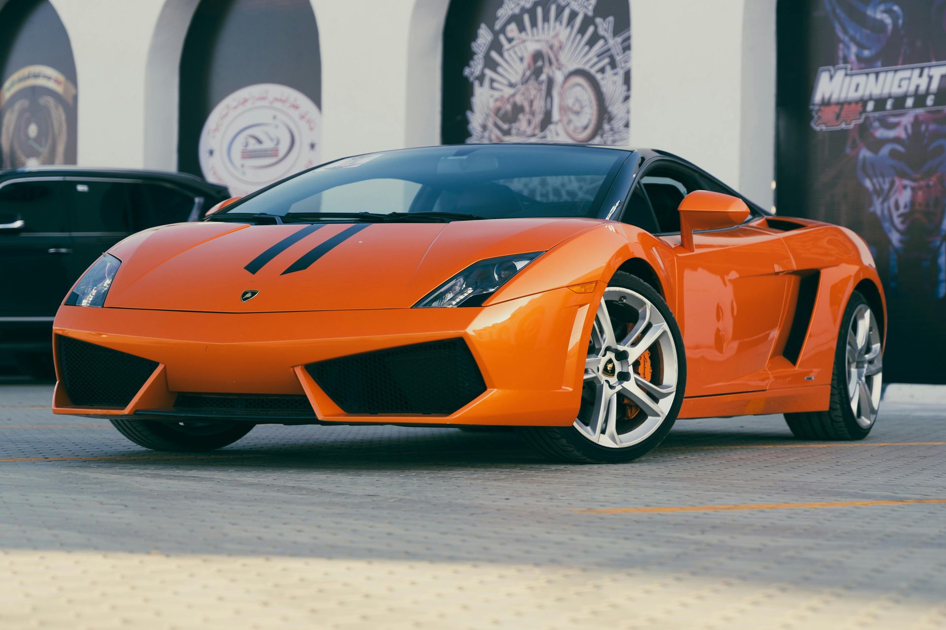 A bright orange lamborghini that is show-room quality after luxury detailing