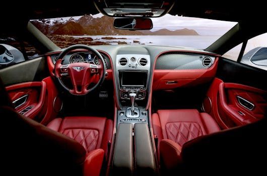 Luxury car interior with red leather seats and clean dashboard after professional car detailing in Fairfax VA