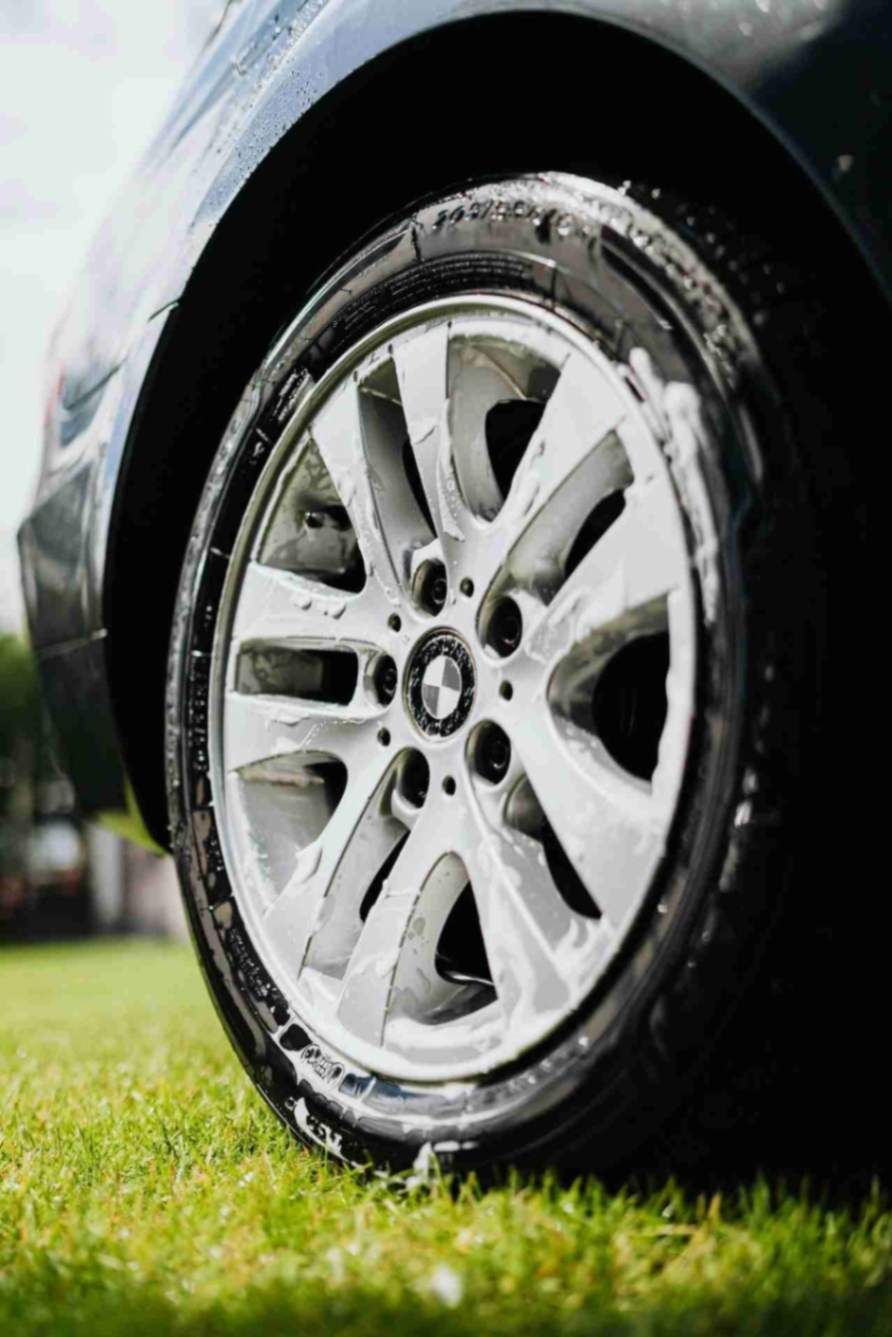 Silver alloy wheel cleaned and detailed to remove brake dust.