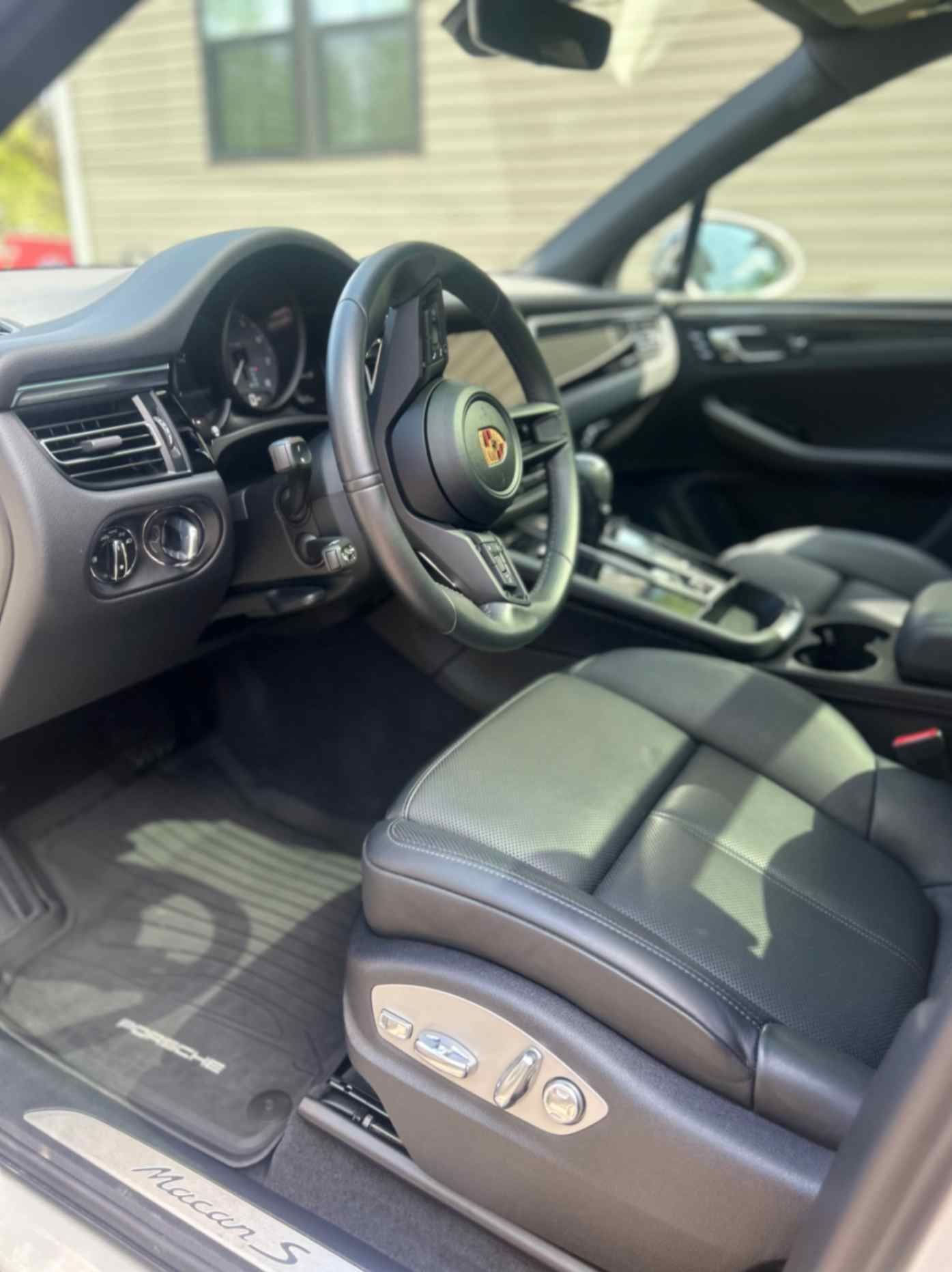 BMW M850i Gran Coupe in dark finish, mirror-like gloss, and sharp body lines after paint-safe wash.