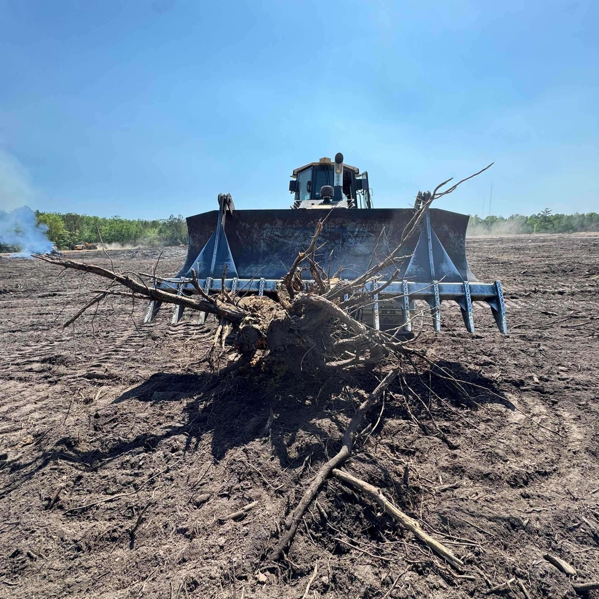 Kitchen with oak cabinets, appliances, and a cluttered work area.