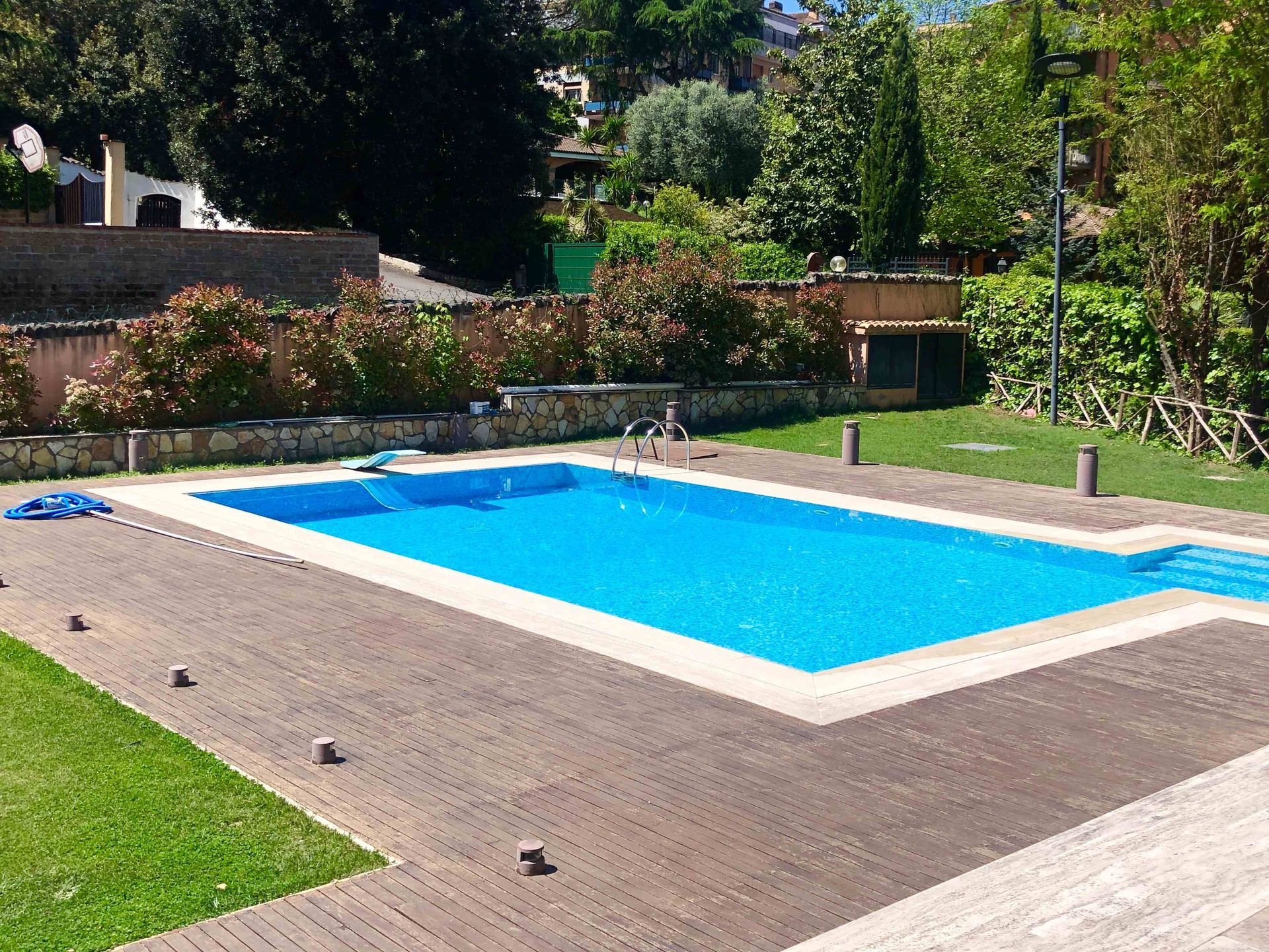 A rectangle pool in a backyard