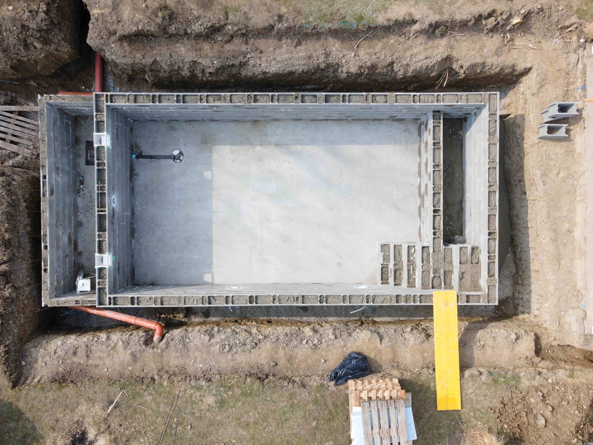 An aerial view of a pool being installed 
