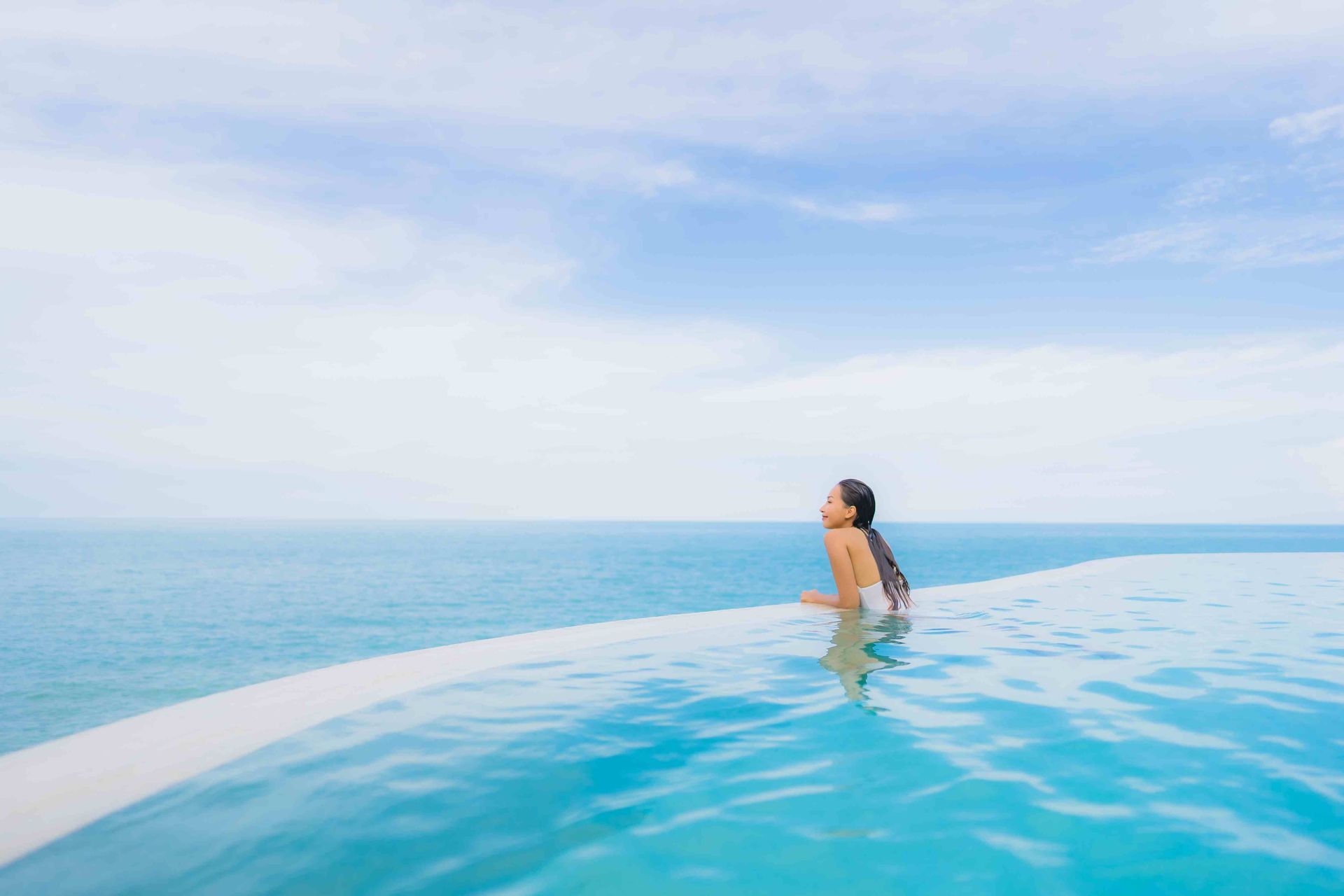 A woman in an infinity pool