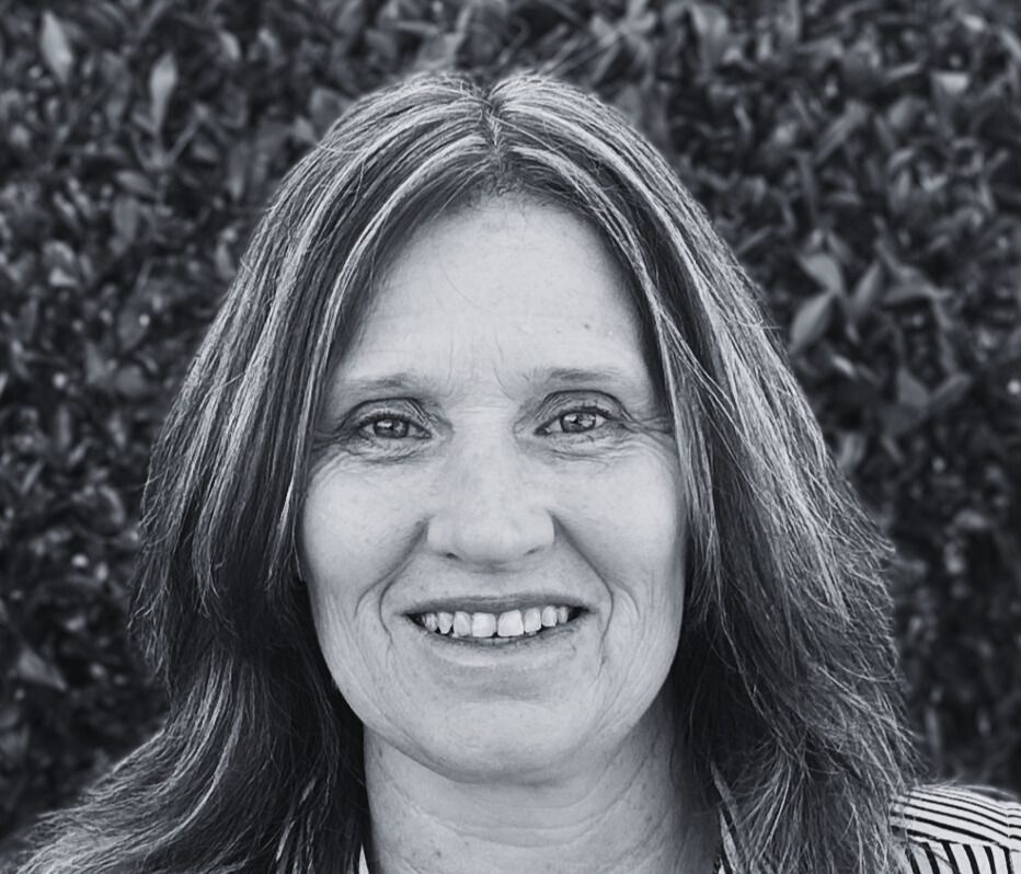 White stylized person symbol with an orange head above a Y shape on a light gray background.