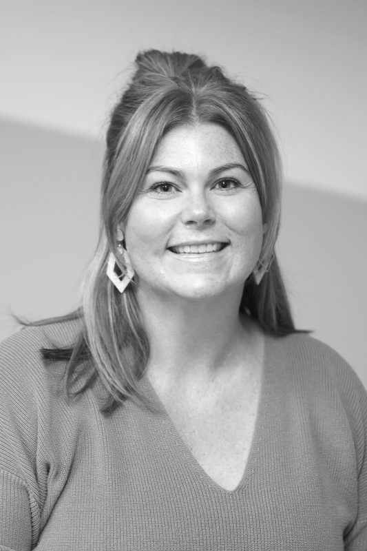 Smiling woman with light brown hair