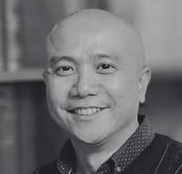 White stylized person symbol with an orange head above a Y shape on a light gray background.