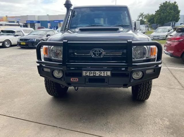 A Black Toyota Truck Is Parked in A Parking Lot — Motor Accessories Direct In Tweed Heads South, NSW