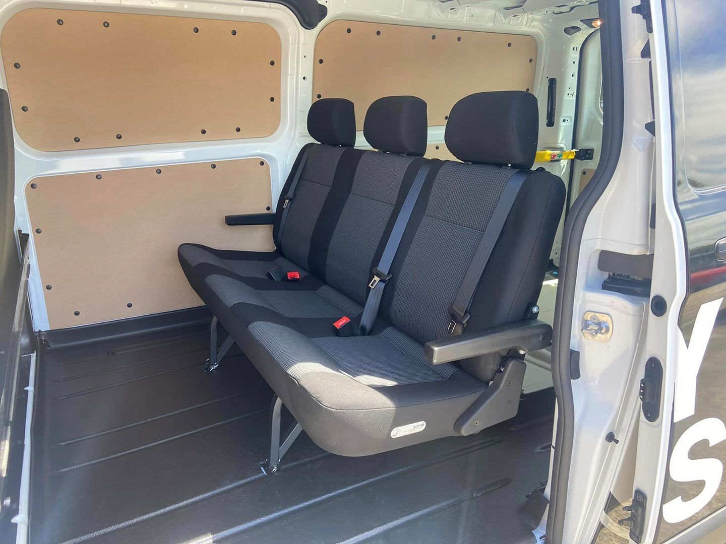 The Inside of A White Van with Three Seats and Headrests — Motor Accessories Direct In Tweed Heads South, NSW