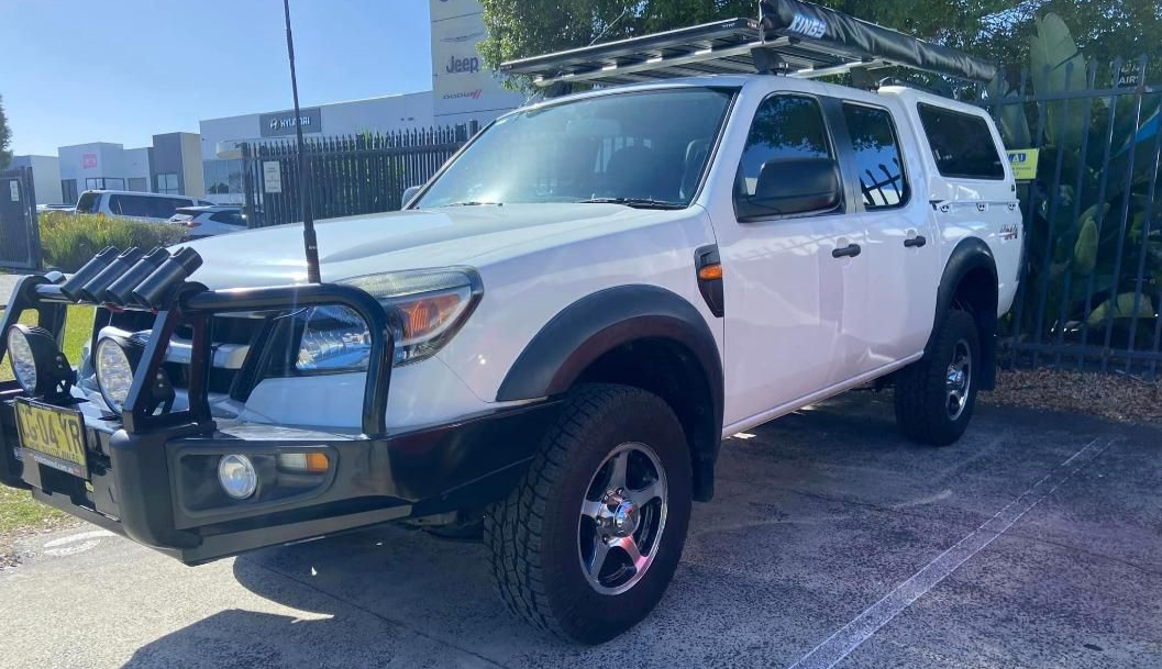 White Ford Truck With Black Brush Guard and Roof Rack, Parked Outdoors — Motor Accessories Direct In Byron Bay, QLD