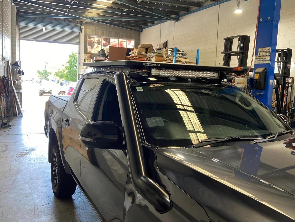 Dark Grey Pickup Truck With Roof Rack, Snorkel, and Light Bar — Motor Accessories Direct In Southport, QLD