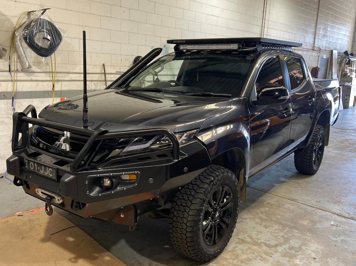 Black Mitsubishi Truck With Off-road Modifications — Motor Accessories Direct In Burleigh Heads, QLD