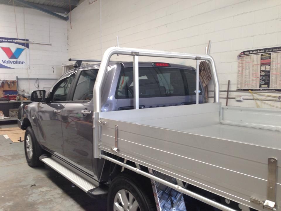 Gray Pickup Truck With a Silver Flatbed and Roll Bar — Motor Accessories Direct In Tweed Heads, NSW