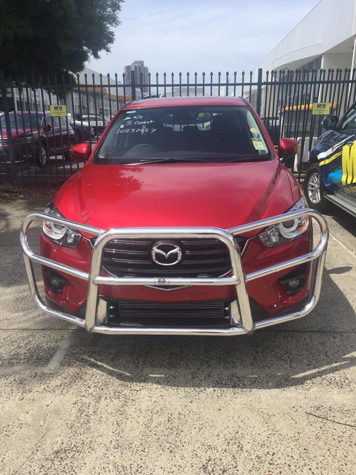 Red Mazda SUV With a Chrome Bull Bar Parked Outside, Sunny Day — Motor Accessories Direct In Tweed Heads, NSW