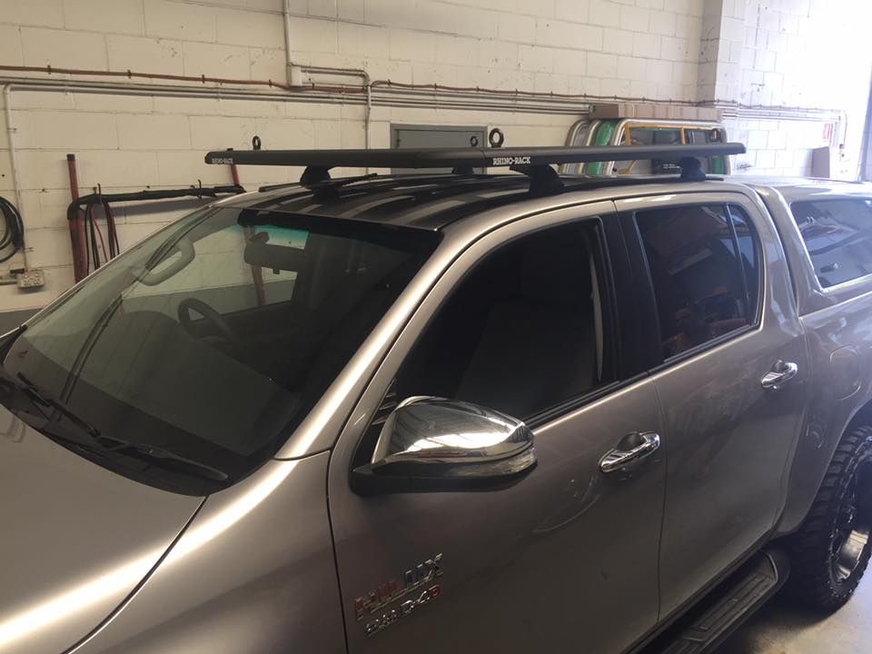Silver Pickup Truck With a Black Roof Rack in a Garage — Motor Accessories Direct In Southport, QLD